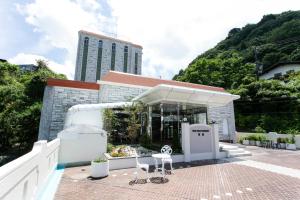 a white building with a building at The Gran Resort Arima in Kobe