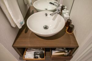 Ein Badezimmer in der Unterkunft 谷町君Hotel 松竹雲 京都四条烏丸