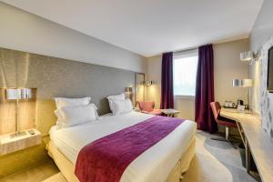 Ein Bett oder Betten in einem Zimmer der Unterkunft Best Western Plus Paris Velizy