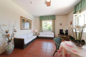 A bed or beds in a room at Orizzonte Acireale Hotel