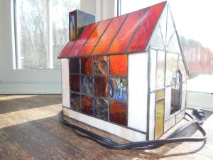 a house made out of stained glass on a table at Natsumi no Sato in Biei