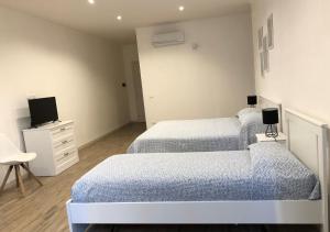 Krevet ili kreveti u jedinici u okviru objekta Hotel Falco D'oro