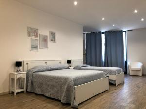 Krevet ili kreveti u jedinici u okviru objekta Hotel Falco D'oro