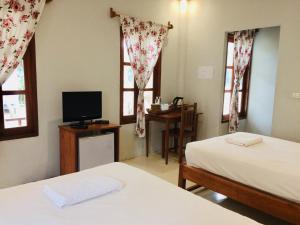 Postel nebo postele na pokoji v ubytování Pai Flora Resort