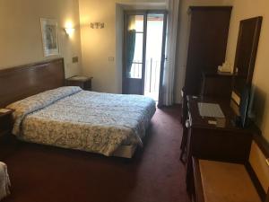 Postel nebo postele na pokoji v ubytování B&B Franceschi