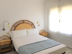 Postel nebo postele na pokoji v ubytování Aiguaneu Sa Marina