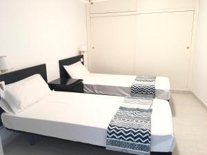 Postel nebo postele na pokoji v ubytování Aiguaneu Sa Marina