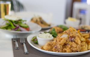 a plate of food on a table with plates of food at Island Boutique Hotel in Larnaca