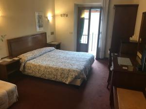 Postel nebo postele na pokoji v ubytování B&B Franceschi