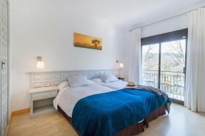 Cama o camas de una habitación en Els Caçadors de Maçanet