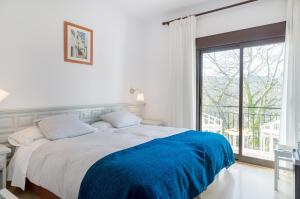 Cama o camas de una habitación en Els Caçadors de Maçanet