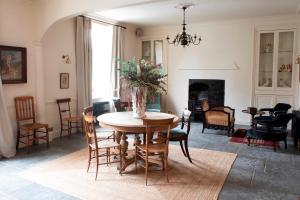 a living room filled with furniture and a fireplace at Victorian House Hotel in Grasmere