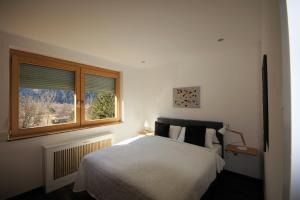 מיטה או מיטות בחדר ב-Ferienhaus Sunseitn mit Ruhe und Unabhängigkeit