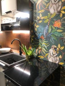 A kitchen or kitchenette at Soho Apartments