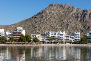 
a large body of water with mountains at Hoposa Bahia in Port de Pollensa
