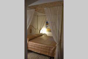 Ліжко або ліжка в номері Trulli del Maestro