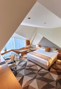 เตียงในห้องที่ Vivanta New Delhi, Dwarka