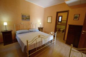 a bedroom with a large bed in a room at Toto Residence in Torre Lapillo +267 photos