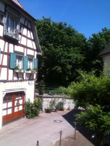 a white building with a door and a balcony at NEU ... in 2 min. am Bodensee in Überlingen