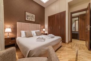 A bed or beds in a room at 900 Apartments Lazio, Emilia & La Corte