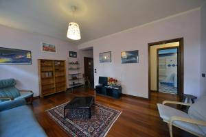 a living room with a couch and a table at Casa Amadi 2 - La tua casa lontano da casa in Brescia