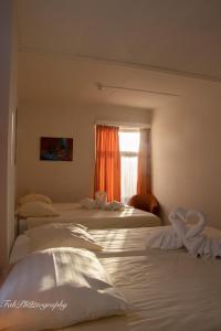 Postel nebo postele na pokoji v ubytování Hotel 2000 Valkenburg