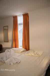 Postel nebo postele na pokoji v ubytování Hotel 2000 Valkenburg