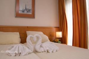 Postel nebo postele na pokoji v ubytování Hotel 2000 Valkenburg