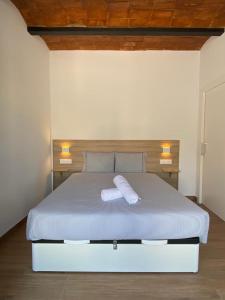 Кровать или кровати в номере VIU BARCELONA BERTRAN