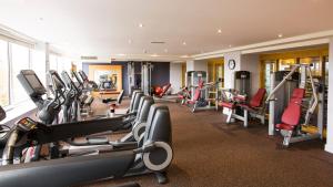 a gym with a bunch of treadmills and machines at Clayton Hotel Burlington Road in Dublin