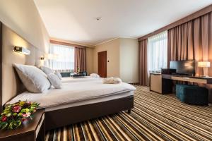 Postel nebo postele na pokoji v ubytování Hotel Victor Pruszków DeSilva