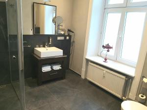 Koupelna v ubytování Hotel Wagner im Dammtorpalais