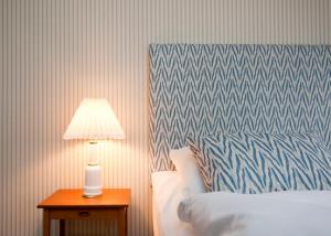 Säng eller sängar i ett rum på Rye115 Hotel