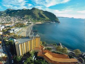 an aerial view of a city and a body of water at Dom Pedro Madeira in Machico