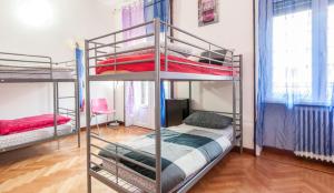 Posteľ alebo postele v izbe v ubytovaní Family Hostel Milano