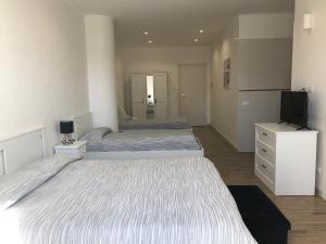 Krevet ili kreveti u jedinici u okviru objekta Hotel Falco D'oro