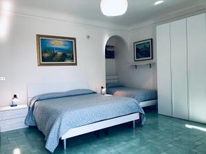 Krevet ili kreveti u jedinici u okviru objekta Hotel Falco D'oro