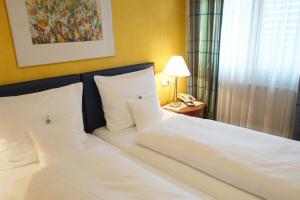 Tempat tidur dalam kamar di Pension Christina