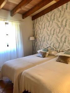 A bed or beds in a room at Ses llimoneres
