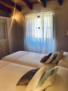 A bed or beds in a room at Ses llimoneres Még 37 kép