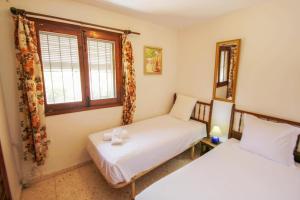 Postel nebo postele na pokoji v ubytování San Jaime 3B - beautiful holiday home in Benissa + 13 fotografií