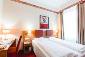 Łóżko lub łóżka w pokoju w obiekcie Hotel Allegro Wien