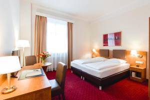 Łóżko lub łóżka w pokoju w obiekcie Hotel Allegro Wien