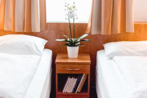Łóżko lub łóżka w pokoju w obiekcie Hotel Allegro Wien