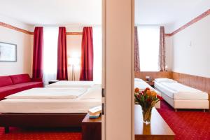Łóżko lub łóżka w pokoju w obiekcie Hotel Allegro Wien