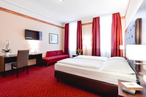 Łóżko lub łóżka w pokoju w obiekcie Hotel Allegro Wien