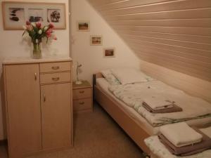 Voodi või voodid majutusasutuse Ferienhaus Hooksiel toas