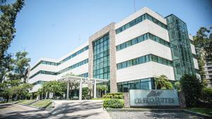 an office building with a sign in front of it at Orfeo Suites Cordoba in Córdoba