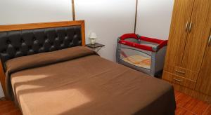 Кровать или кровати в номере Cabañas del Arroyo Calafate (CRyPPSC)