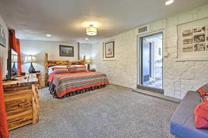 a bedroom with two beds and a window at Retro Updated Blanco Abode - Steps to Main Street! in Blanco